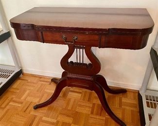 49B-  $195 Mahogany console/game table Lyre center 32”L x 30”T x 32” when open or 16” closed