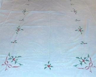 Vintage Ivory Embroidered Christmas Holly Tablecloth 96" x 65"  12 Napkins 16"x16"  and THE EDGES ARE SCALLOPED.  NAPKINS NEVER USED AND TABLECLOTH USED ONCE. TABLECLOTH AND NAPKINS ARE IN EXCELLENT CONDITION.   THE TABLECLOTH HAS SOME SMALL MARKS NOTHING MAJOR.  NO RIPS, HOLES OR BURNS.  $25.00
