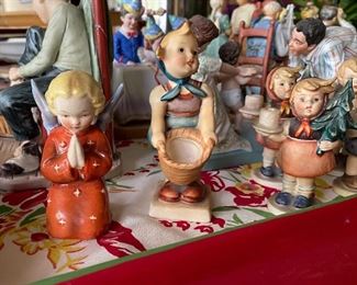 Vintage, very old Hummel figurines.  All in excellent condition.                                                                                                               Red Dress/Star Angel 4 1/2" Germany  $20.00                               Little Helper 4 1/2" Germany   $20.00                                              Set of 4 Advent Candlestick Figurines  Girl with Fir, Girl with Nosegay, Boy with Horse   $15.00