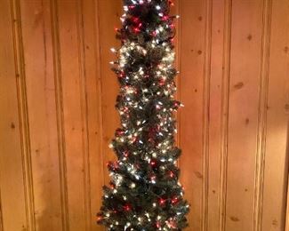 7'x2' slim/pencil Christmas Tree with many lights.  Comes with foot press on /off switch  $25.00