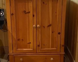 Solid Pine Armoire Entertainment Cabinet.   Like new condition!  34"x23"x48" high  Inside  31" wide and 30" from inside top to top of the shelf.  $100.00   Receiver and CD player not included.
