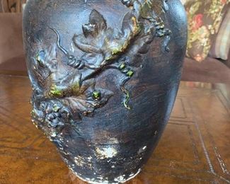 Very unique Maitland Smith pottery vase.  13" high and 9" at the widest point.  The vase is Handmade in Thailand.  The imperfections are part of the decor of the vase.  $25.00
