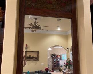 Mirror is almost 6' tall, looks to be teak. 
