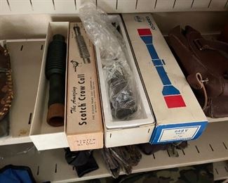 Vintage crow call, with box. A few rifle scopes. 