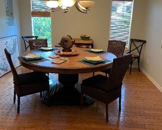 Round dining room set with four chairs made out of wood