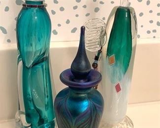 The center perfume bottle has been sold but the other two are still available.