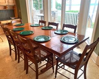 Expandable trestle table (AVAILABLE) and 8 matching cane seat chairsSOLD (priced separately)