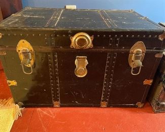 there are several vintage trunks