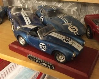 About 8-10 great scale model cars... many Ford cobras