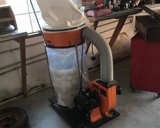 Dust collection system... gets that tiny wood!