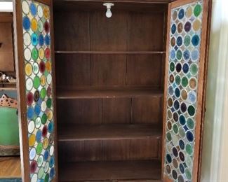 97" Height X 57" Width X 20" Depth                                                        Doors are made from bottle bottoms and slight damage to a couple of them.  This cabinet does have a light inside 