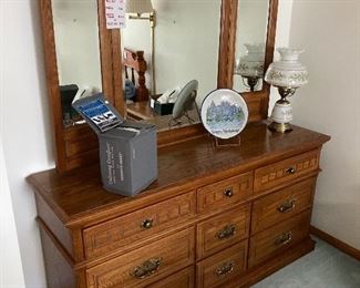 Bureau with mirror which is part of a four piece bedroom set