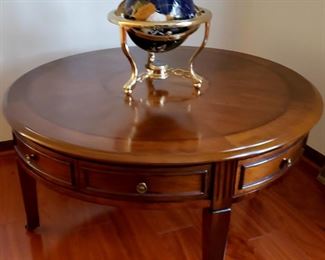 Coffee table has four double drawers & globe made of polished semi precious stones