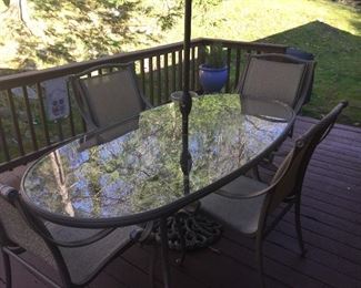 Outdoor dining table and chairs with umbrella