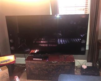 65" has built in side speakers. Smart TV