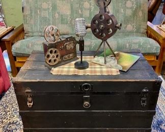 Black Antique TRUNK with original front clasps and a cute 3-piece decorative metal pieces representing film/stage AND a Pine Framed Folding FUTON