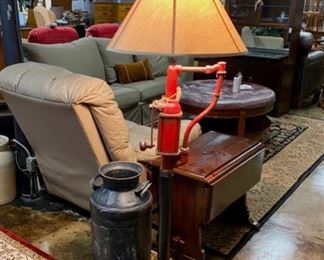 An antique black milk can and an old red pump refurbished into a unique and one-of-a-kind floor lamp by Cass Neighbors, from Soddy Daisy, TN. 