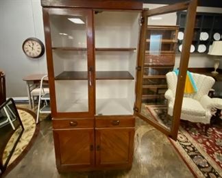 Antique Solid Wooden Cabinet with Glass Doors and a white interior 