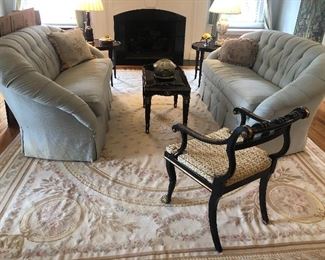 Designer single-cushion loveseats with pillows and French hand-knotted needlepoint rug