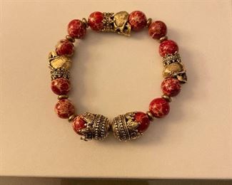 red bracelet - stretch - price 5 dollars