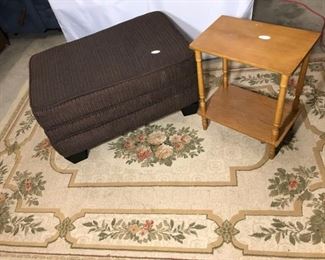Area rug, ottoman, and side table group