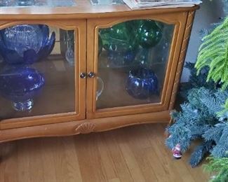 Curio Cabinet  and contents for sale.  Cabinet is about 48 inches wide and 30 inches tall.   Solid wood