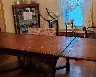 Solid Wood table with 20 inch leaves at each end. 