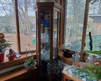 Corner curio cabinet for sale and all the contents (crystals-cut glass, colored glass bowls etc.)
