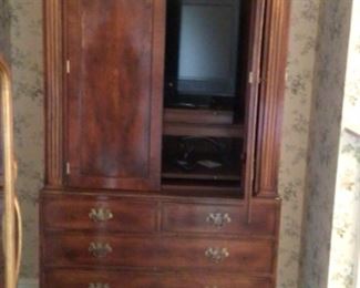 Classic Armoire entertainment center with swivel stand for tv. 5 drawers. 41”x 84”.                                           Made in Sussex England by Trosby Furniture. $2900