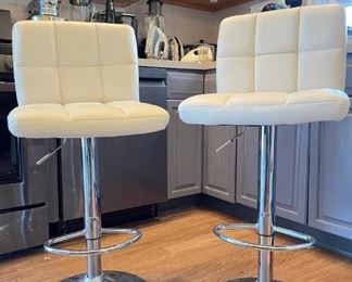 Two height adjustable counter stools