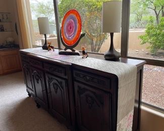 Another pic of the sideboard buffet draped by the obi. Plus we have art glass and lamps that will work in any room of your house.