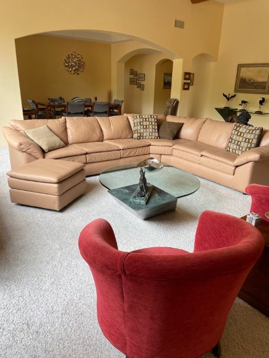 Custom made leather sofa console with matching ottoman.