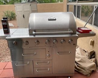 The NXR grill is practically new and has storage and additional features.