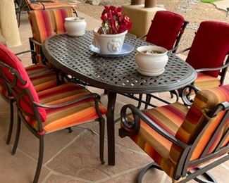 Sit down in our metal patio furniture set with comfy cushions.