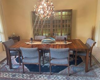 Splendid mid-century modern walnut dining room table with chairs, room size Persian rug, Plus a 70s china cabinet/bookcase with lighting. These pieces raise the bar on Mid-century modern.