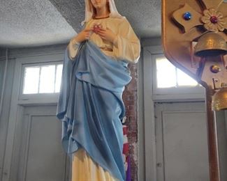 Mary, mother of God, standing on the Earth