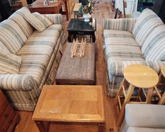 Pennsylvania house sofa and loveseat, giant wicker trunk/coffee table, pair of wooden stools, other tables