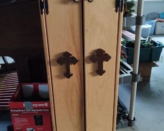 Cabinet with crosses on doors