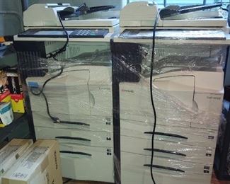 A pair of Kyocera KM-4035 commercial copy-scanner-fax office machines with cords and extra toners!