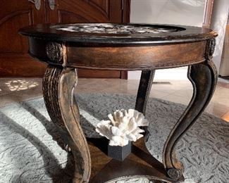 Elegant carved wood table with wrought iron insert 