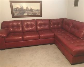 Dark Red/Burgundy Sectional Sofa.  Excellent, like new condition from a no smoking/no pets home.  10/10 Comfy.  Sofa: 119W x 36D x 36H.  Chaise: 84W x 36D x 36H.  Seat depth: 22".