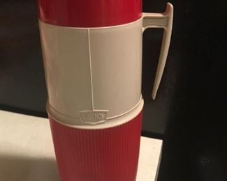 Vintage red and tan thermos.
