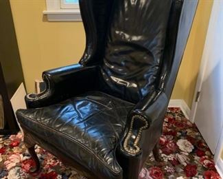 76. Black Leather Wing Back Chair w/ Nailhead Detail (31" x 29" x 49")