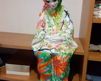 Paper mache clown seated statue