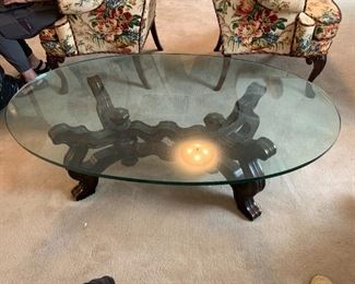 #13	Glass top coffee table w/ wood carved base w/bronze/gold highlights 52l x 32w x 16h	 $75.00 
