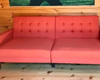 Sleek and simple orange/red sofa