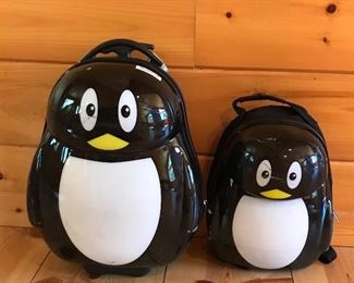 Penguin rolling suit case and back pack