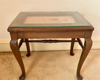 Small end table with glass display top.