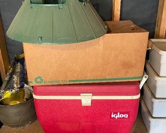 Igloo cooler, Christmas tree stand in the garage.