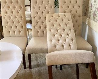 Four upholstered dining room chairs